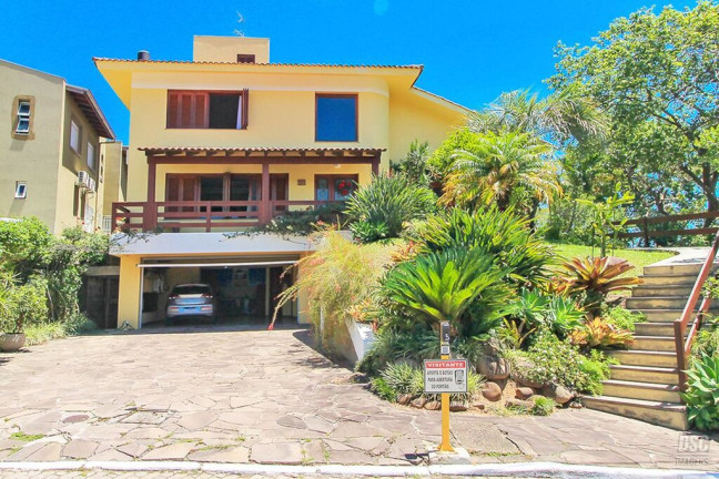 Foto do imóvel Casa de Condomínio com 3 Quartos à Venda, 389 m² em Vila Nova - Porto Alegre